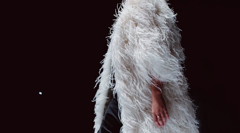 Fashion details of Haute couture white ostrich feather coat